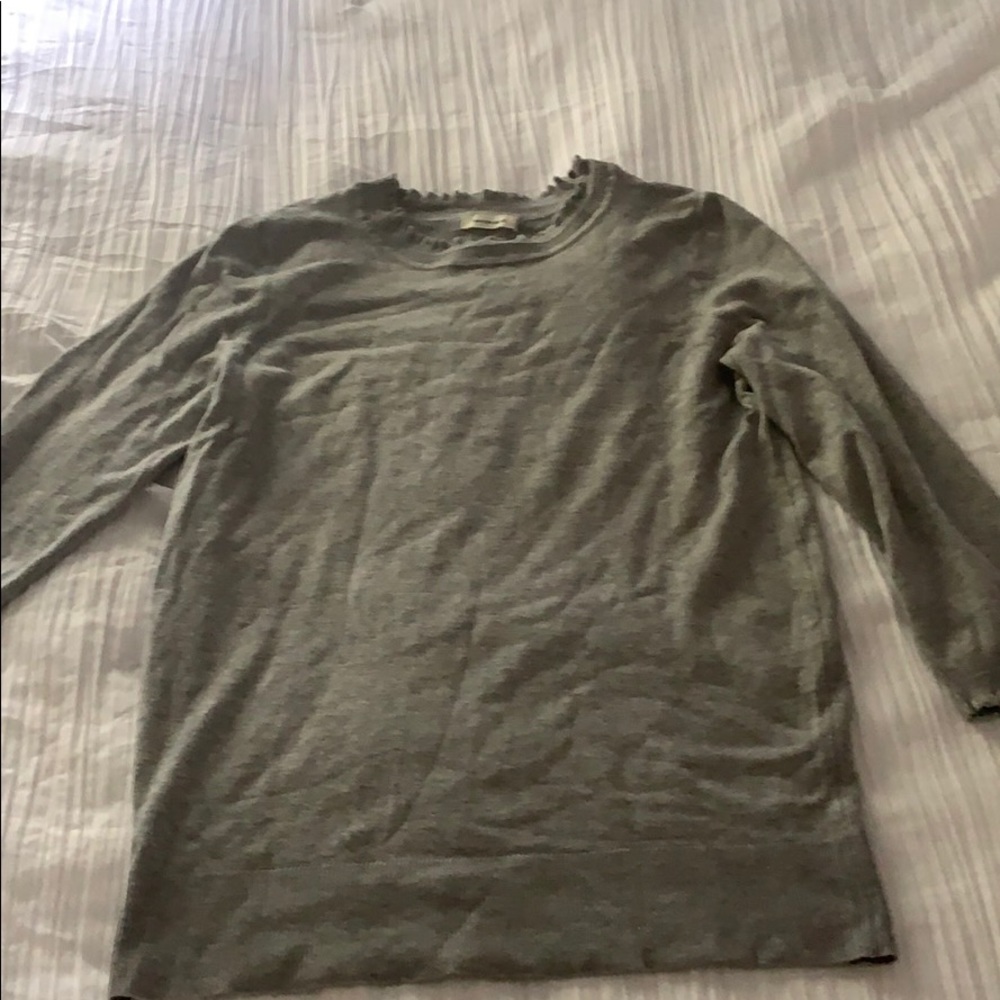 a grey sweater